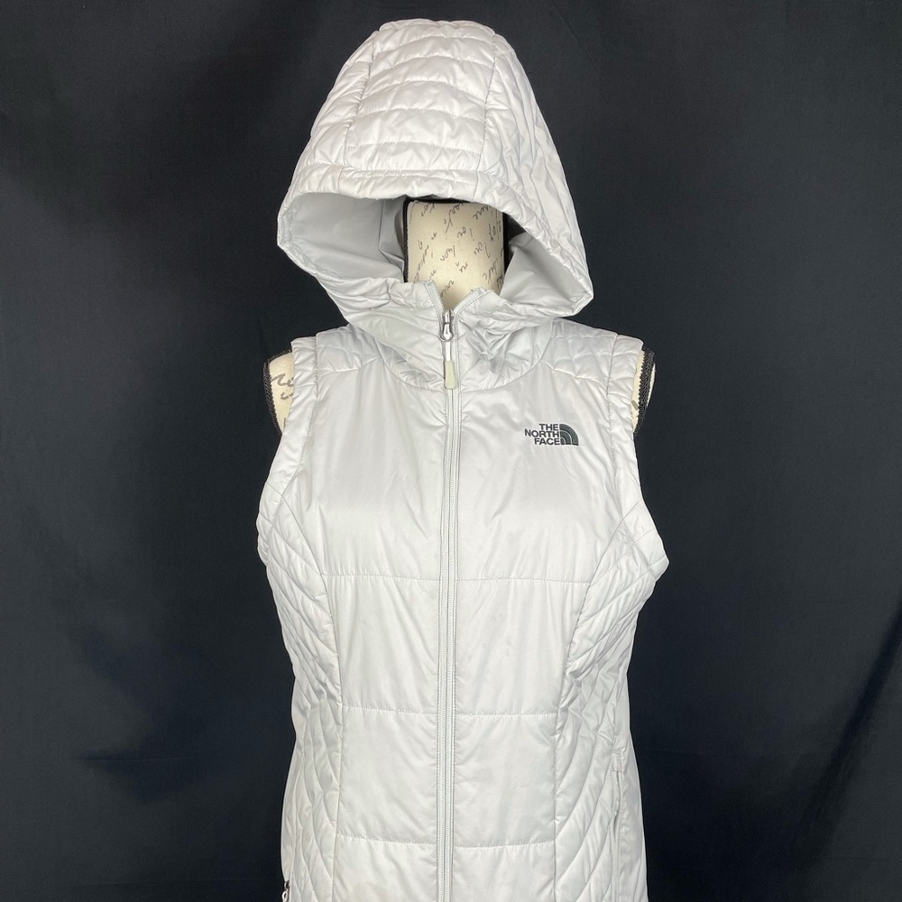 Used gray woman vest. Clear stain on bottom